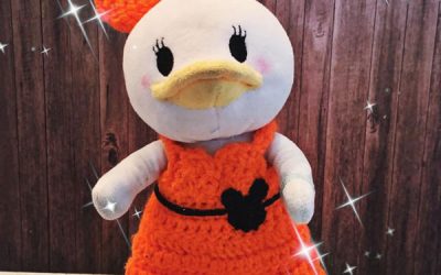 Schleifchen und Kleid in orange